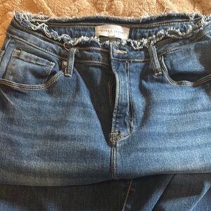 Risen High Rise Blue Jeans with Distressed Waistband and Classic Medium Wash